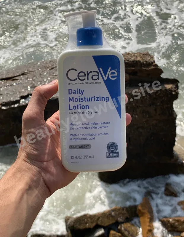 CeraVe daily moisturizing lotion held by a hand with a natural background