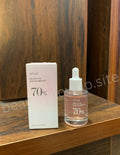 ANUA Peach 70 Niacin Serum on wooden surface Korean skincare