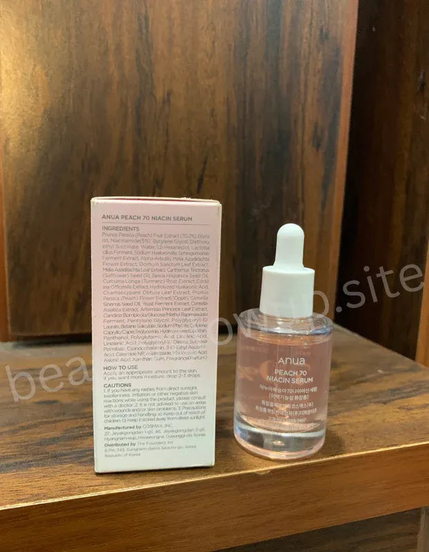 ANUA Peach 70 Niacin Serum on wooden surface Korean skincare