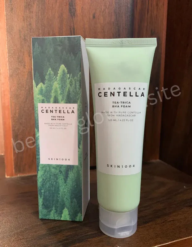 Skintone Madagascan Centella tea tree BHA foam with packaging on a wooden surface