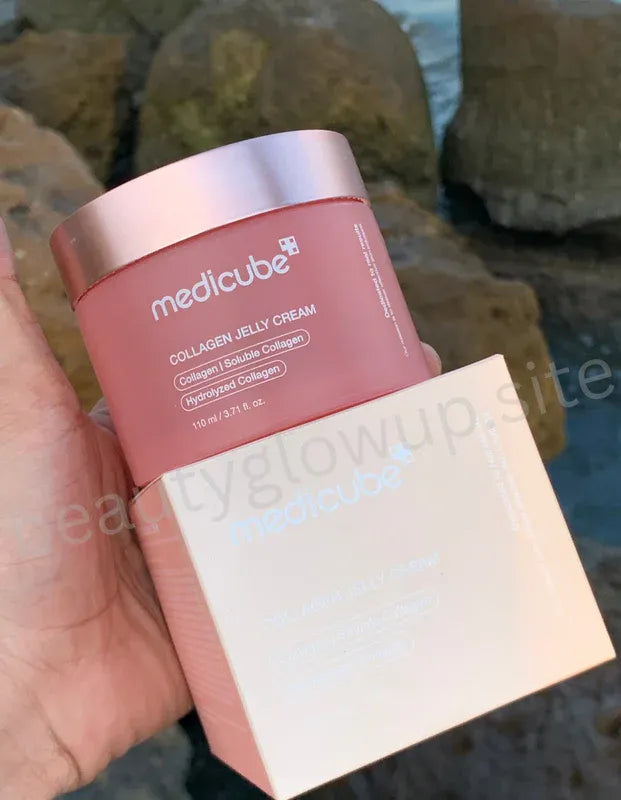 Medicube Collagen Jelly Cream jar held by a hand with a blurred natural background